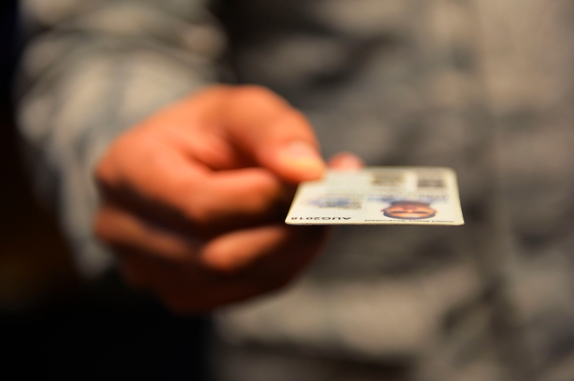 Staff Sgt. Stephen Ellis, 86th Airlift Wing public affairs broadcast journalist craftsman, holds a common access card on Ramstein Air Base, Germany, Jan. 19, 2018. The 786th Force Support Squadron instituted changes in how appointments are made for requesting new I.D. cards and renewing dependent I.D.’s. (U.S. Air Force photo by Senior Airman Joshua Magbanua)