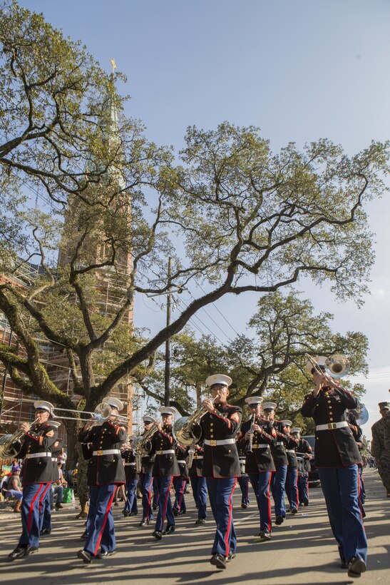 Marines with Marine Corps Band New Orleans perform “Anchors Aweigh” during the Krewe of Alla Mardi Gras parade, New Orleans, Feb. 4, 2018. Marine Corps Band New Orleans performs in multiple Mardi Gras parades annually to celebrate the Mardi Gras season and to show Marine Corps presence in the New Orleans Community
