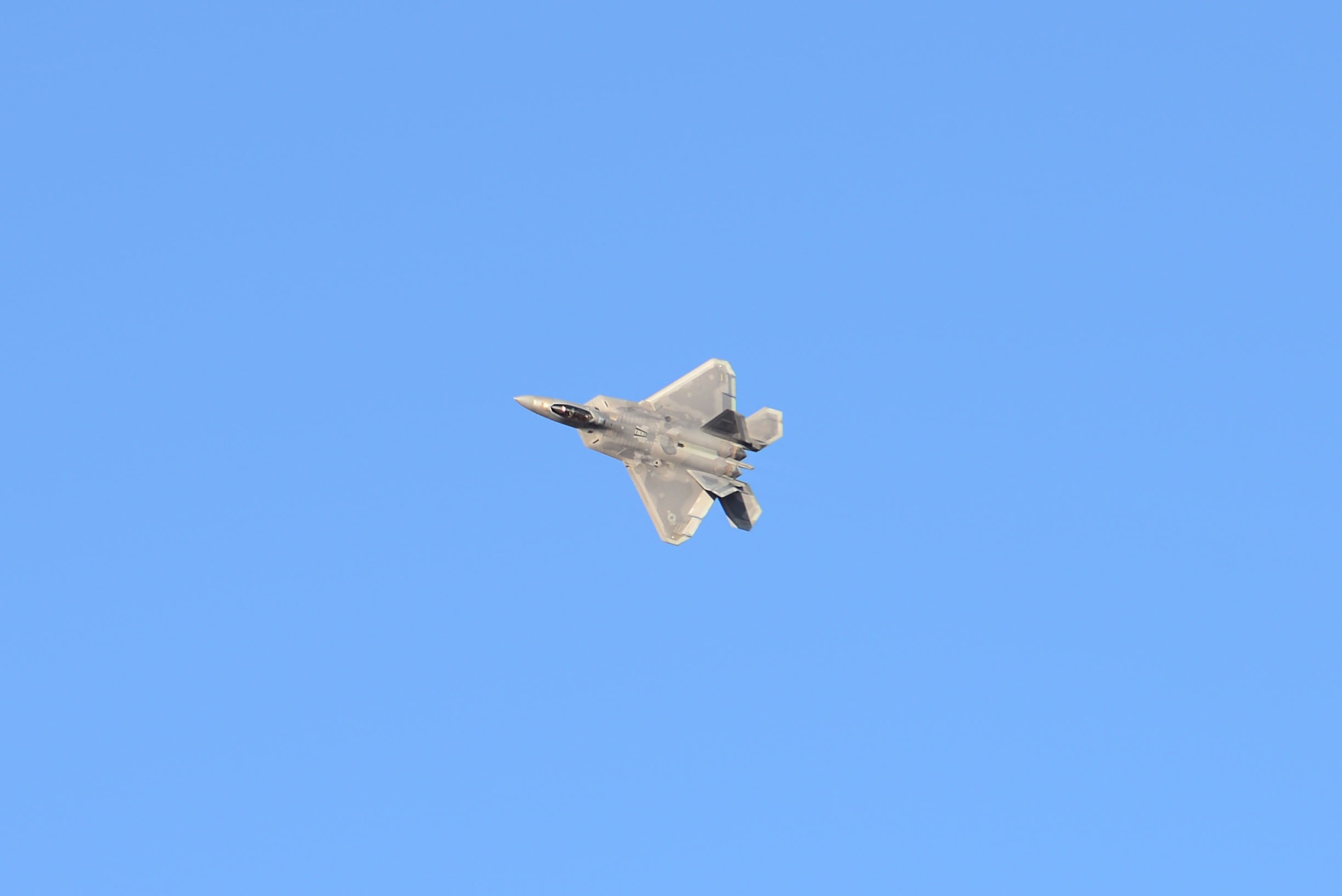 An F-22 Raptor, flown by Maj. Paul Lopez, practices aerial acrobatics during a demonstration Feb. 2, 2018, at Columbus Air Force Base, Mississippi. The F-22 is designed to project air dominance, rapidly and at great distances and defeat threats attempting to deny access to our nation's Air Force, Army, Navy and Marine Corps. (U.S. Air Force photo by Airman 1st Class Beaux Hebert)