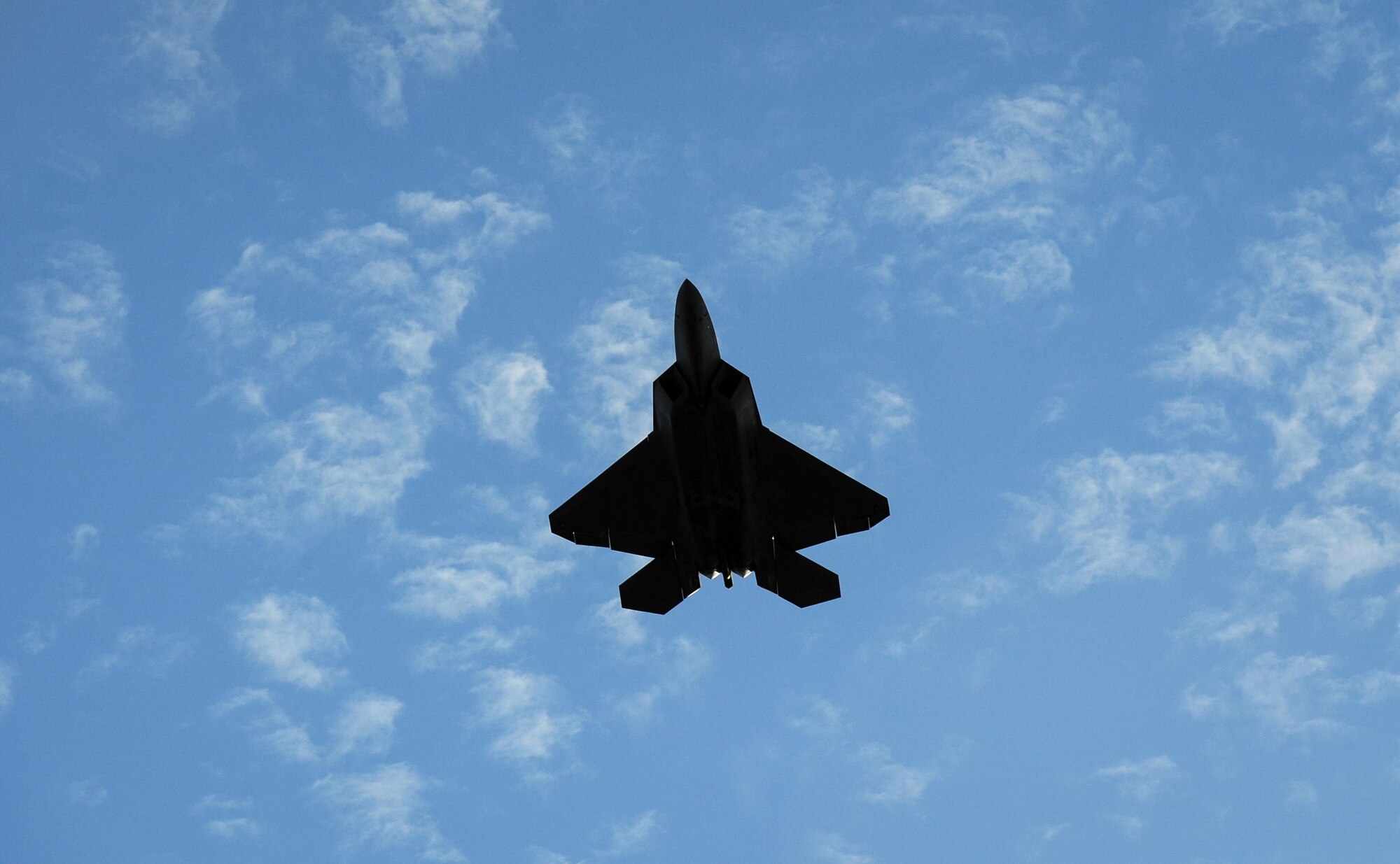 An F-22 Raptor, flown by Maj. Paul Lopez, flies over the flight line on Columbus Air Force Base, Mississippi, Feb. 2, 2018, during an aerial demonstration. Lopez is a member of Air Combat Command’s F-22 Single Ship Demonstration Team at Joint Base Langley Eustis, Virginia. Lopez utilized the airspace at and around Columbus AFB as he prepared for the 2018 air show season.  (U.S. Air Force photo by Tech. Sgt. Christopher Gross)