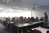 U.S. Army Reserve Sgt. 1st Class Dave Mercado, right, Force Protection NCO, 85th Support Command, gives remarks during an Army Reserve Physical Security Workshop held at the Army Reserve’s 85th Support Command headquarters, Feb. 6-7, 2018.