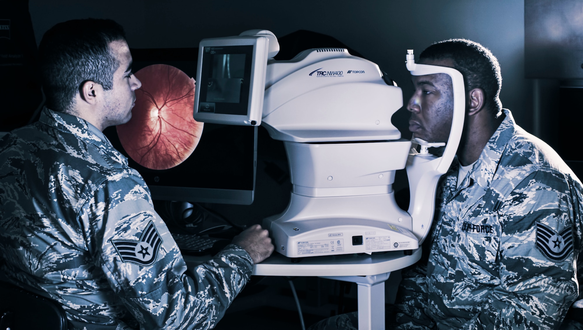 Staff Sgt. Javier Caballero conducts an eye exam