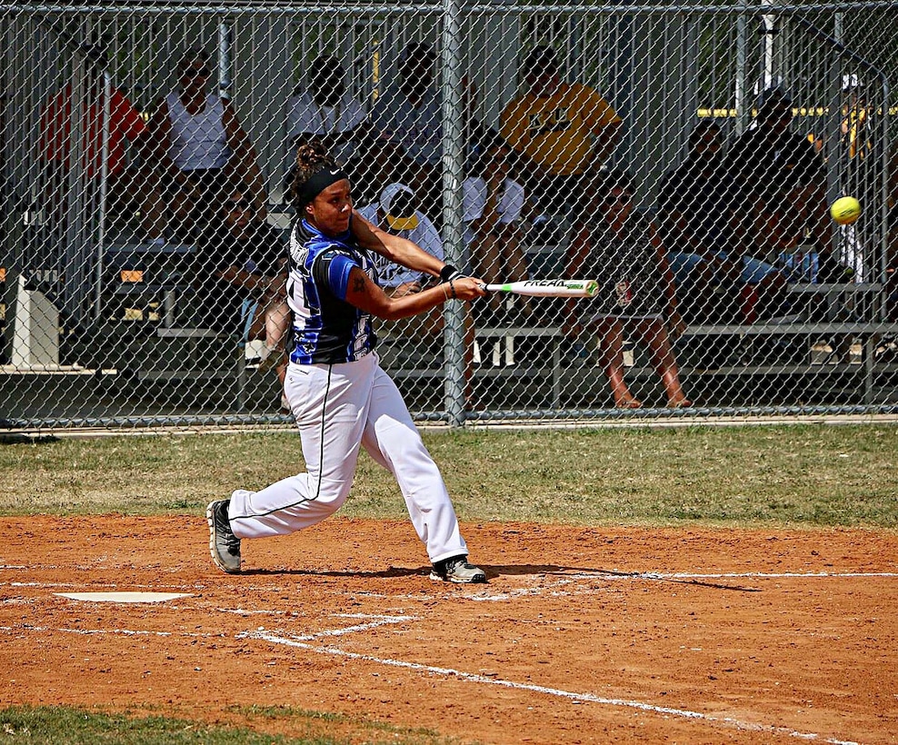 U.S. Air Force Airman 1st Class Daniella Cortez, 633rd Force Support Squadron commander support staff, swings her bat during a softball game. Her team won with zero defeats during the 2017 season.