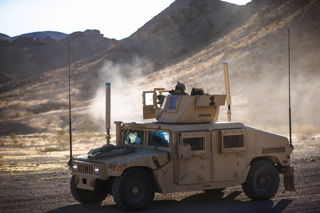 Lance Cpl. Charles Wohlers, 1st LE Gunner, Marine Wing Support Squadron 371, fires an M240 Bravo during the Motorized Fire and Movement Exercise exercise on range 114, at Marine Corps Air Ground Combat Center, Twentynine Palms, Calif., Jan. 18, 2018, as a part of Integrated Training Exercise 2-18. The purpose of ITX is to create a challenging, realistic training environment that produces combat-ready forces capable of operating as an integrated MAGTF. (U.S. Marine Corps Photo by Pfc. William Chockey)
