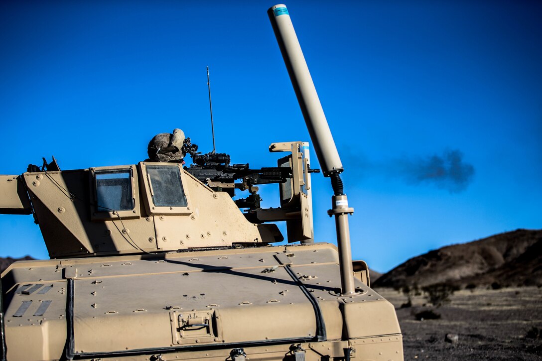 Lance Cpl. Charles Wohlers, 1st LE Gunner, Marine Wing Support Squadron 371, fires an M240 Bravo during the Motorized Fire and Movement Exercise exercise on range 114, at Marine Corps Air Ground Combat Center, Twentynine Palms, Calif., Jan. 18, 2018, as a part of Integrated Training Exercise 2-18. The purpose of ITX is to create a challenging, realistic training environment that produces combat-ready forces capable of operating as an integrated MAGTF. (U.S. Marine Corps Photo by Pfc. William Chockey)