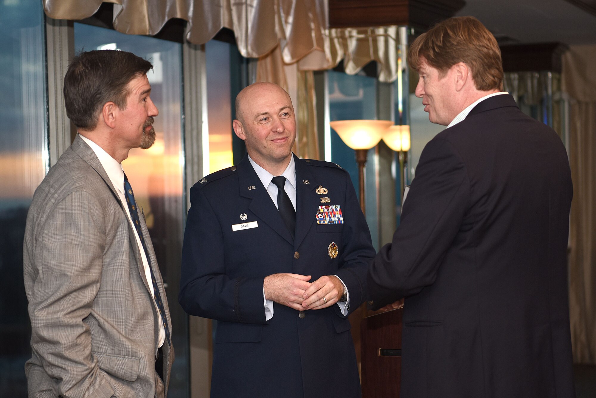 Bill Lavers, Harrison County Development Commission executive director, right, speaks with Col. Danny Davis, 81st Mission Support Group commander, middle, and Charles Eastman, Million Air Gulfport-Biloxi general manager, left, during the Mississippi Coast Foreign Trade Zone dinner at The Great Southern Club, Jan. 31, 2018, in Gulfport, Mississippi. The FTZ No. 92 was established in 1983 and is made up of different companies that contribute to the Mississippi Gulf Coast economy. The annual gathering enables executives and board members of the various public entities and individual zone users an opportunity to come together in one place at the same time to learn more about zone-related activities and issues, and to hear from a guest speaker about other community-related activities, or FTZ and trade-related topics. As the guest speaker, Davis highlighted Keesler’s community partnerships as well as the increasing economic impact the base has on the Mississippi Gulf Coast economy. (U.S. Air Force photo by Airman 1st Class Suzanna Plotnikov)
