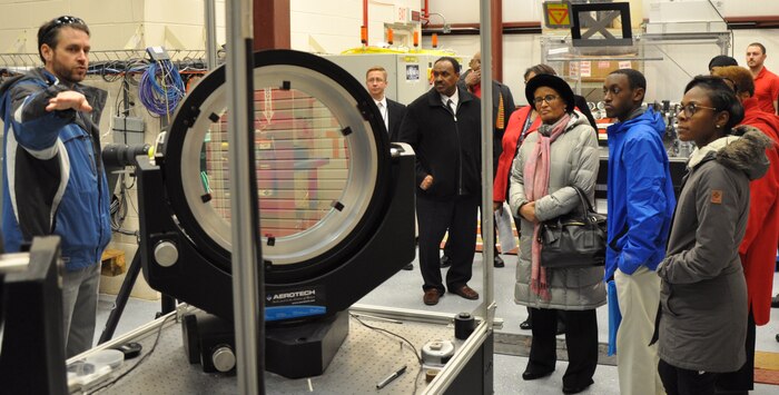 IMAGE: DAHLGREN, Va. (Feb. 2, 2018) - Hampton University officials, professors, and students are briefed on U.S. Navy high energy laser programs by Dr. Chris Lloyd, High Energy Laser Lethality lead at Naval Surface Warfare Center Dahlgren Division (NSWCDD). Lloyd explained the importance of rigorous modeling and laboratory testing against target materials to ensure high energy laser systems are built that meet the requirements of warfighters once fielded. The Hampton University visitors observed a high power laser demonstration and saw the laboratory's 100 meter long, above ground tunnel. The tunnel - crucial to gun range operations during World War II - was recently transformed into a vital new capability for testing laser technologies.