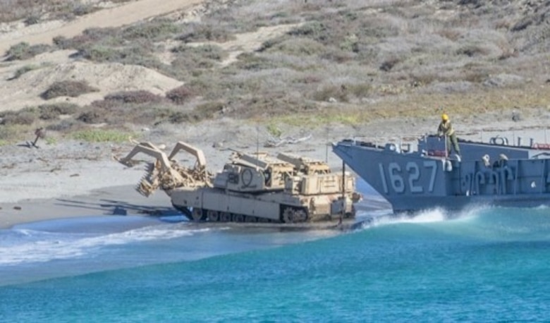 U.S. Marines from 1st Combat Engineer Battalion, 1st Marine Division, conduct the first amphibious landing in an Assault Breacher Vehicle with a Modified Full Width Mine Plow prototype during Exercise Steel Knight on the west coast. Marine Corps Systems Command tested the prototype which will make it easier to transport the ABV from ship to shore.