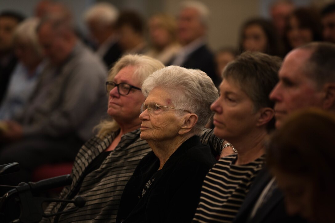 Irma Wilburn, wife of Sgt. Maj. Ray V. Wilburn, listens to the eulogy of her husband at protestant chapel aboard Marine Corps Air Ground Combat Center Twentynine Palms Cali., Jan. 13, 2018. Retired Sgt. Maj. Ray V. Wilburn served 32 years of honorable and faithful service to the United States Marine Corps while taking part in World War 2, the Korean War, and Vietnam. (U.S. Marine Corps photo by Irma Wilburn, wife of Sgt. Maj. Ray V. Wilburn, listens to the eulogy of her husband at protestant chapel aboard Marine Corps Air Ground Combat Center Twentynine Palms Cali., Jan. 13, 2018. Retired Sgt. Maj. Ray V. Wilburn served 31 years of honorable and faithful service to the United States Marine Corps while taking part in World War 2, the Korean War, and Vietnam. (U.S. Marine Corps photo by Pfc. William Chockey)