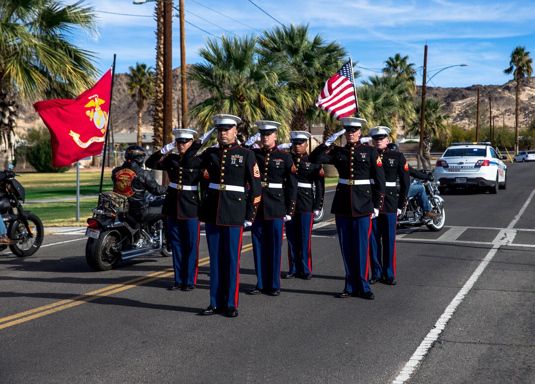 The Headquarters battalion pall bears salute the motorcade while it goes by during retired Sgt. Maj. Ray V. Wilburn funeral at the protestant chapel aboard Marine Corps Air Ground Combat Center Twentynine Palms Cali., Jan. 13, 2018. Retired Sgt. Maj. Ray V. Wilburn served 32 years of honorable and faithful service to the United States Marine Corps while taking part in World War 2, the Korean War, and Vietnam. (U.S. Marine Corps photo by Pfc. William Chockey)