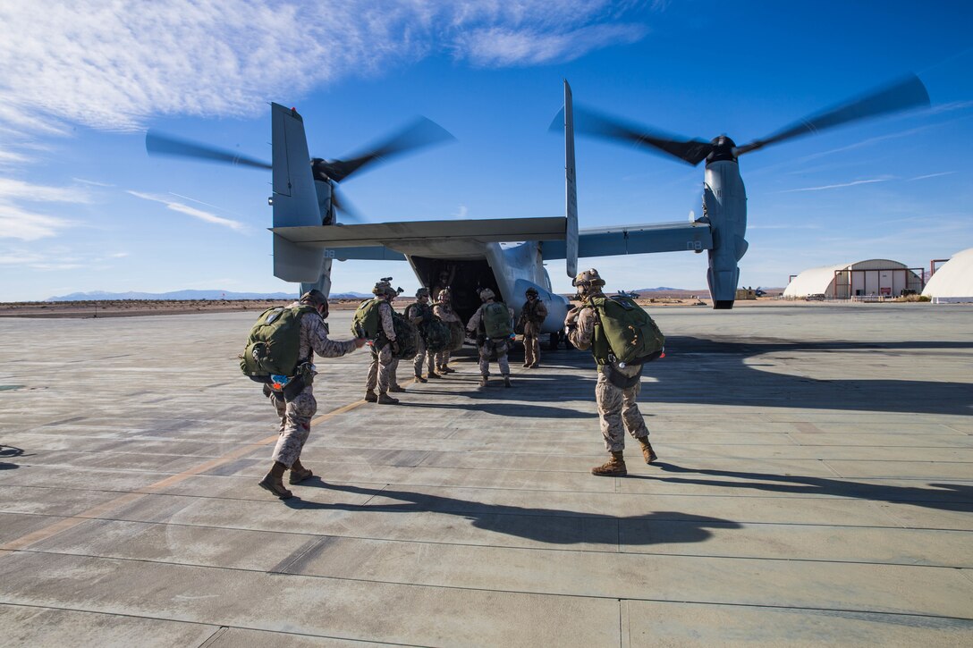Marines with 3rd Reconnaissance Battalion, 3rd Marine Division, 3rd Marine Expeditionary Force board a MV-22 Osprey at the Air Combat Element landing strip at Marine Corps Air Ground Combat Center, Twentynine Palms, Calif., Jan. 18, 2018, as a part of Integrated Training Exercise 2-18. The purpose of ITX is to create a challenging, realistic training environment that produces combat-ready forces capable of operating as an integrated MAGTF. (U.S. Marine Corps Photo by Pfc. William Chockey)