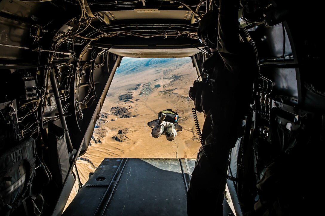 Marines with 3rd Reconnaissance Battalion, 3rd Marine Division, 3rd Marine Expeditionary Force conduct a jump out of an MV-22 Osprey at Marine Corps Air Ground Combat Center, Twentynine Palms, Calif., Jan. 18, 2018, as a part of Integrated Training Exercise 2-18. The purpose of ITX is to create a challenging, realistic training environment that produces combat-ready forces capable of operating as an integrated MAGTF. (U.S. Marine Corps Photo by Pfc. William Chockey)