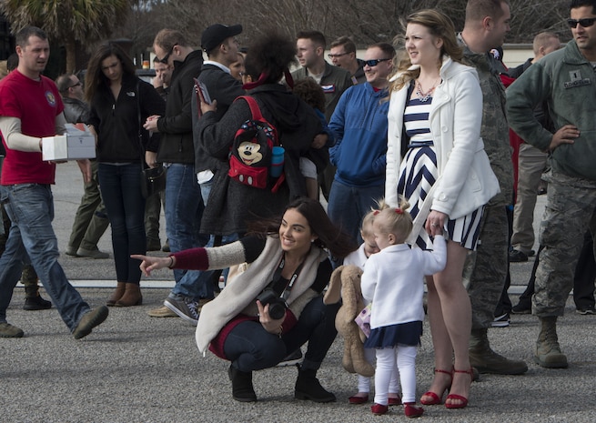 Airmen from the 15th Airlift Squadron and 437th Maintenance Group are greeted by family members and friends after returning to Joint Base Charleston, S.C., Feb. 3, 2018, from a Southwest Asia deployment.