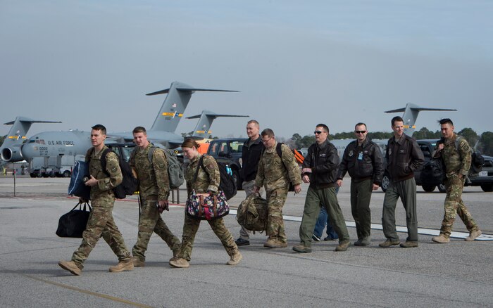 Airmen from the 15th Airlift Squadron and 437th Maintenance Group are greeted by family members and friends after returning to Joint Base Charleston, S.C., Feb. 3, 2018, from a Southwest Asia deployment.
