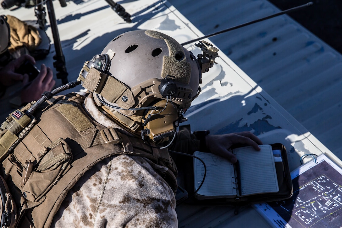A Marine with 3rd Reconnaissance Battalion, 3rd Marine Division, 3rd Marine Expeditionary Force calls in air support at Marine Corps Air Ground Combat Center, Twentynine Palms, Calif,. Jan. 23, 2018, as a part of Integrated Training Exercise 2-18. The purpose of ITX is to create a challenging, realistic training environment that produces combat-ready forces capable of operating as an integrated MAGTF. (U.S. Marine Corps Photo by Pfc. William Chockey)