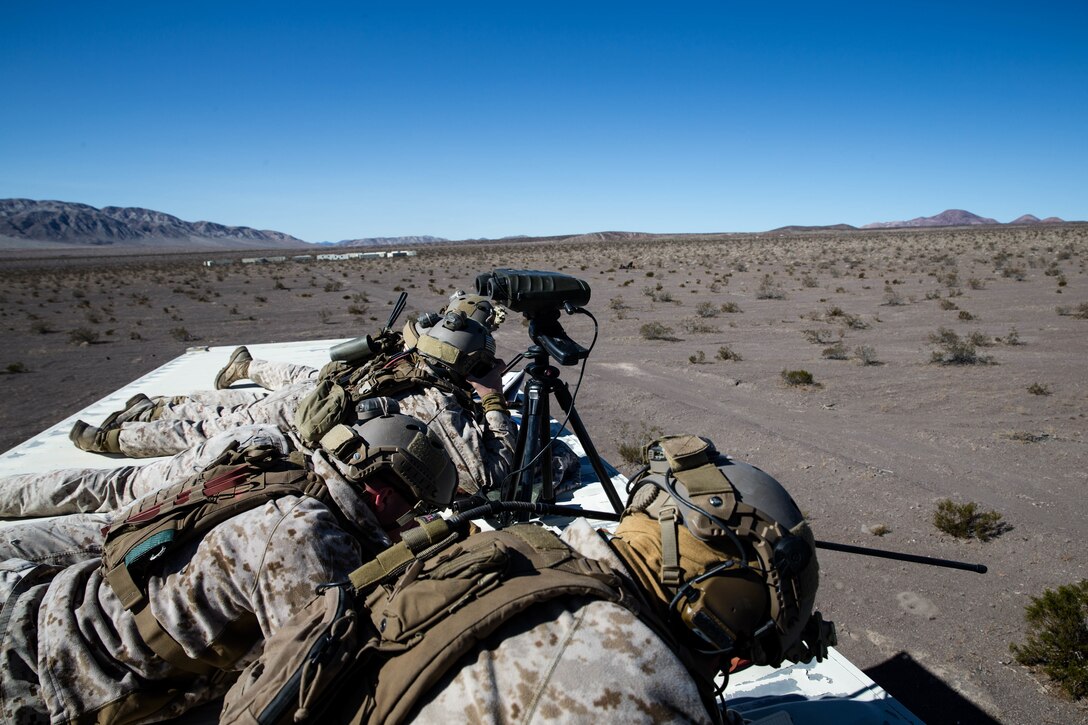Marines with 3rd Reconnaissance Battalion, 3rd Marine Division, 3rd Marine Expeditionary Force  calls in air support on a MOUT town at Marine Corps Air Ground Combat Center, Twen-tynine Palms, Calif,. Jan. 23, 2018, as a part of Integrated Training Exercise 2-18. The purpose of ITX is to create a challenging, realistic training environment that produces combat-ready forces capable of operating as an integrated MAGTF. (U.S. Marine Corps Photo by Pfc. William Chockey)