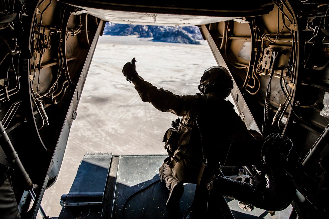 A Marine with Marine Wing Support Squadron 371 scans the skies in an MV-22 Osprey at Marine Corps Air Ground Combat Center, Twentynine Palms, Calif., Feb. 4, 2018, as a part of Integrated Training Exercise 2-18. The purpose of ITX is to create a challenging, realistic training environment that produces combat-ready forces capable of operating as an integrated MAGTF. (U.S. Marine Corps Photo by Pfc. William Chockey)