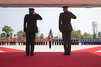 Marine Corps Gen. Joe Dunford, chairman of the Joint Chiefs of Staff, renders honors with Thai Army Gen. Tarnchaiyan Srisuwan, chief of the Defense Force, at the Royal Thai Armed Forces Headquarters in Bangkok, Feb. 7, 2018.