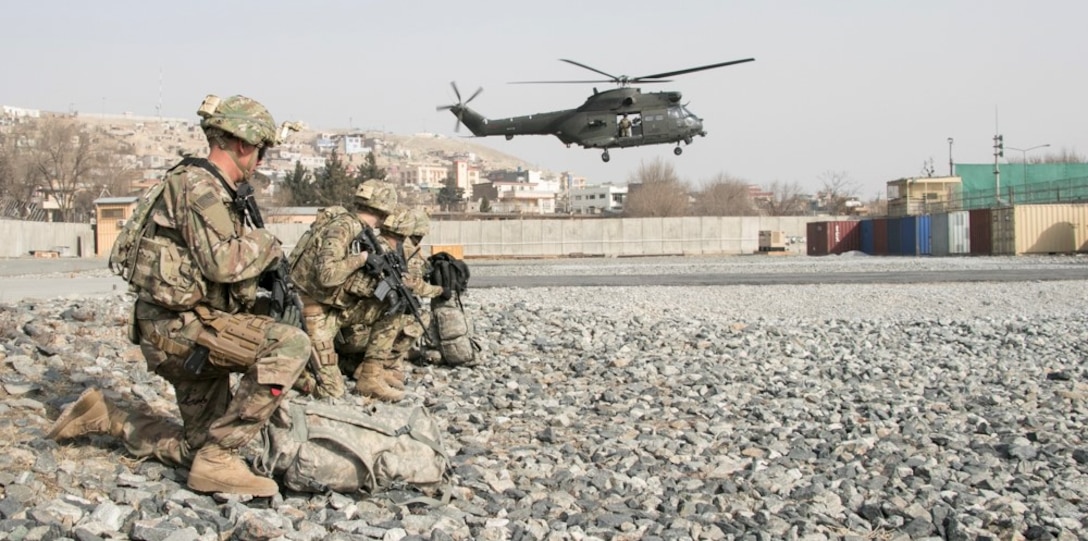 U.S. and British coalition partners and Afghan security forces train together in an aerial reaction force exercise utilizing British helicopter assets at Camp Qargha in Kabul, Afghanistan.