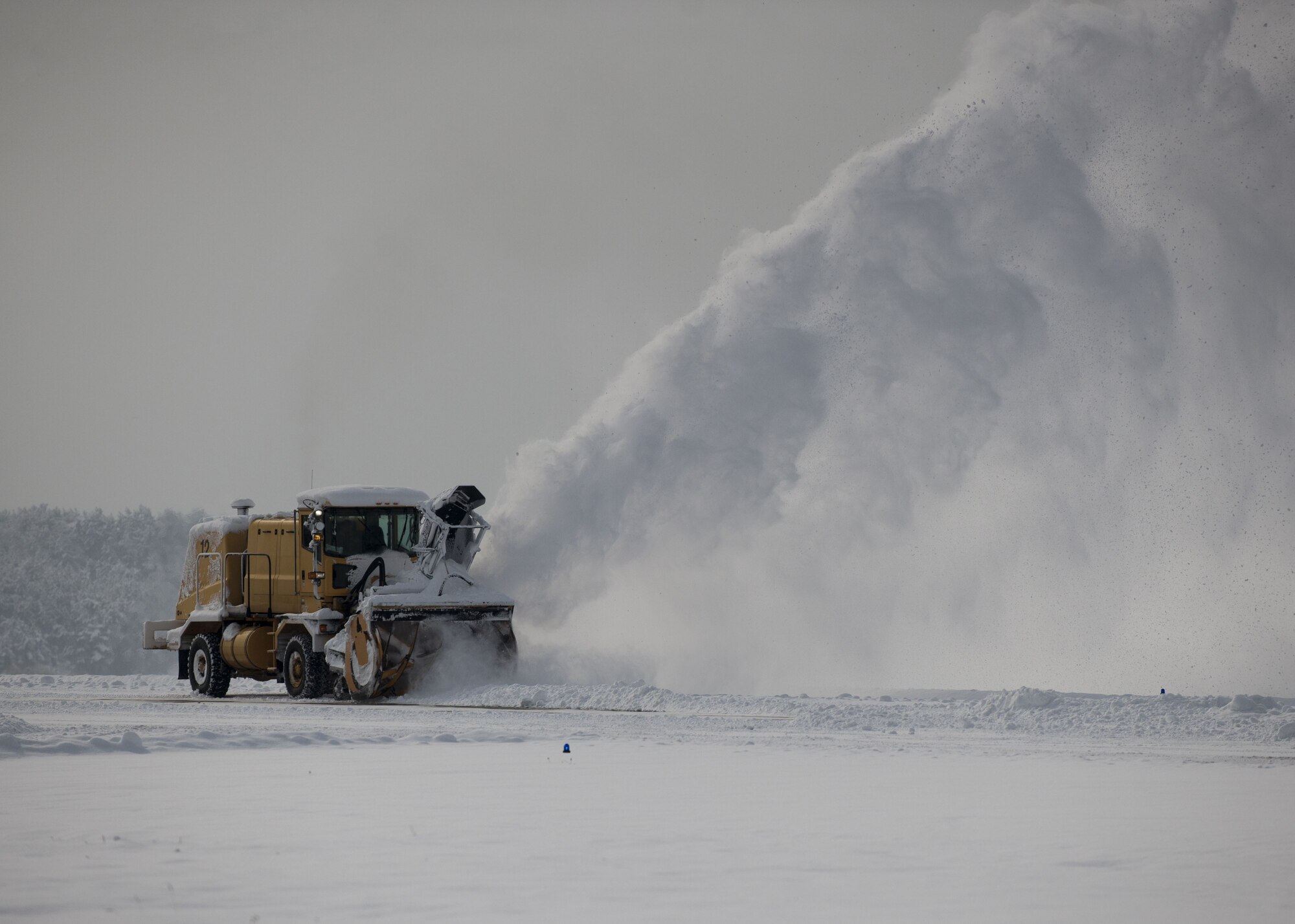 An Airman assigned to the 8th Civil Engineer Squadron operates a snow plow to clear the runway at Kunsan Air Base, Republic of Korea, Jan. 11, 2018 and ensure the continuation of flight operations. During the second week of January more snow accumulated at Kunsan than in all of 2017, requiring snow removal teams to conduct 24-hour operations to maintain mission readiness. (U.S. Air Force photo by Staff Sgt. Victoria H. Taylor)