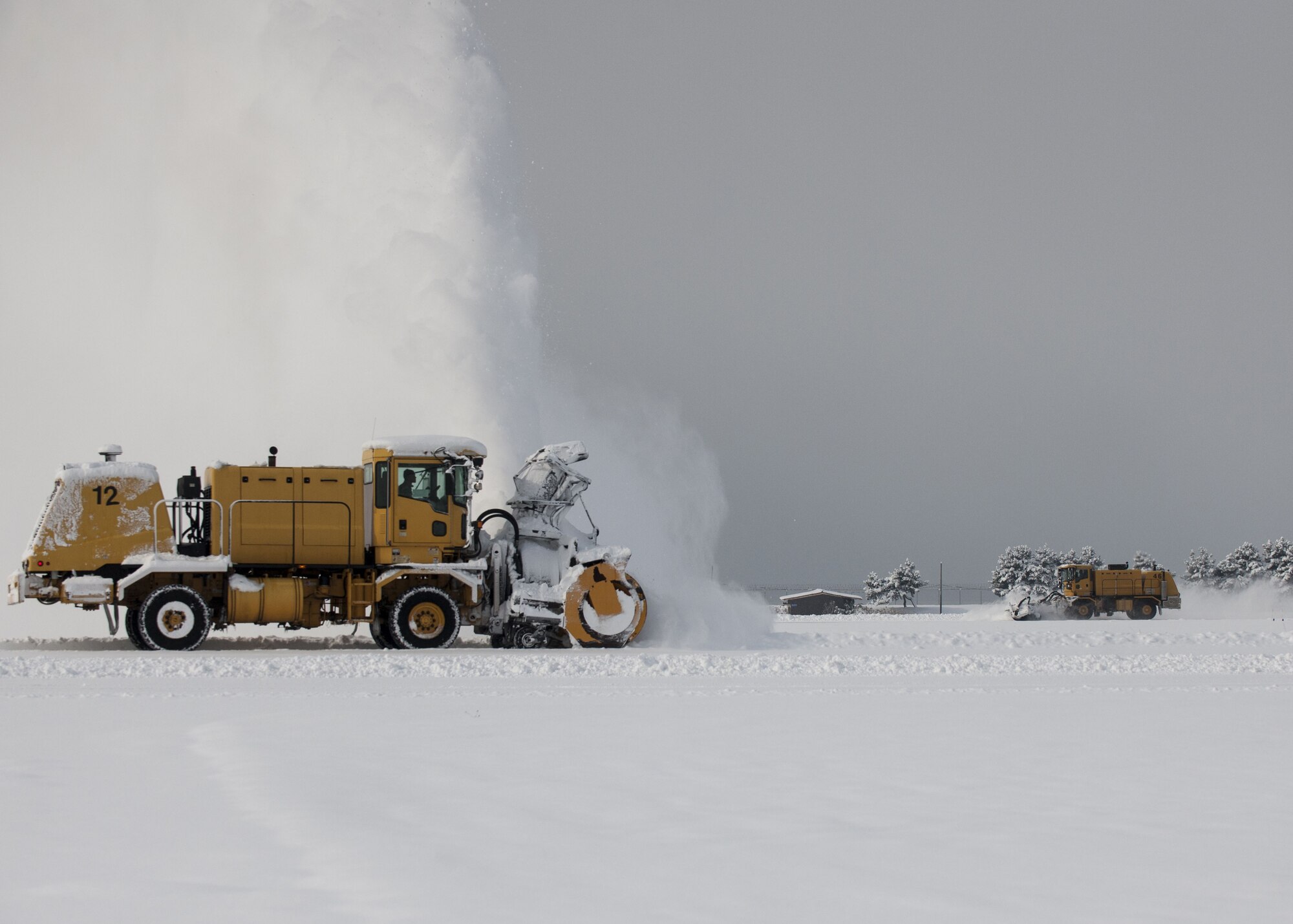 Airmen assigned to the 8th Civil Engineer Squadron operate snow plows to clear the runway at Kunsan Air Base, Republic of Korea, Jan. 11, 2018. During the second week of January more snow accumulated at Kunsan than in all of 2017, requiring snow removal teams to conduct 24-hour operations to maintain mission readiness. (U.S. Air Force photo by Staff Sgt. Victoria H. Taylor)