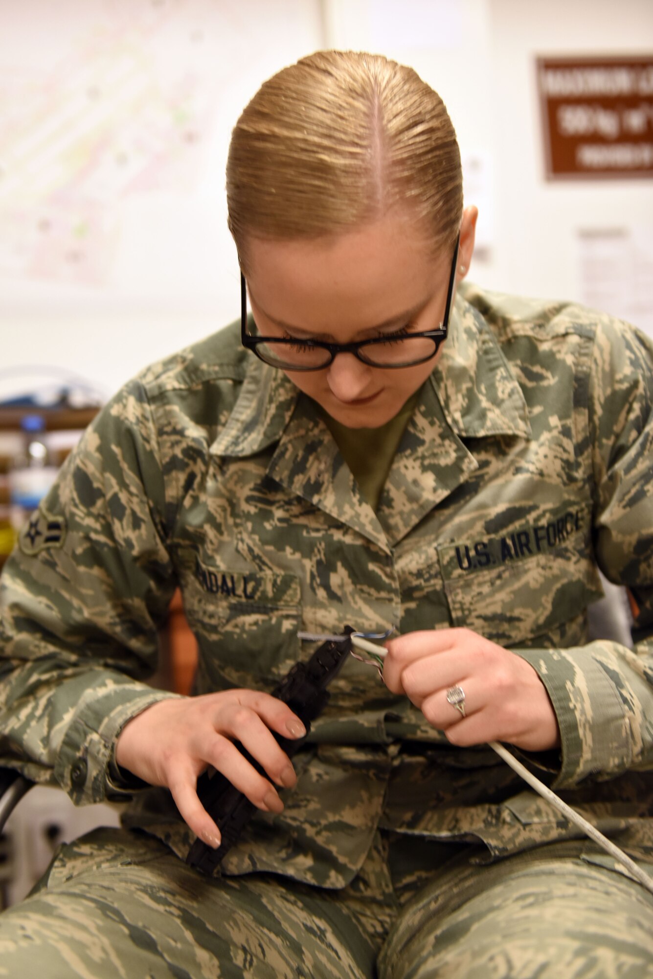 U.S. Air Force Airman 1st Class Ily Kendall, 39th Communications Squadron cyber transport systems technician, fabricates an ethernet cable at Incirlik Air Base, Turkey, Jan. 16, 2018.
