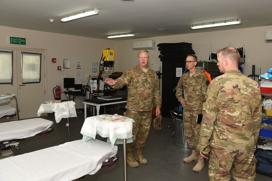 U.S. Air Force Col. Bradley Nielsen, 332nd Expeditionary Medical Group commander, tells Col. Shane Steinke, 322nd Air Expeditionary Wing vice commander, about new medical equipment at the base clinic at an undisclosed location Feb. 5. Bradley also briefed Steinke about the type of care the clinic can provide and what would require a medical evacuation. (U.S. Air Force photo by Staff Sgt. Joshua Edwards/Released)