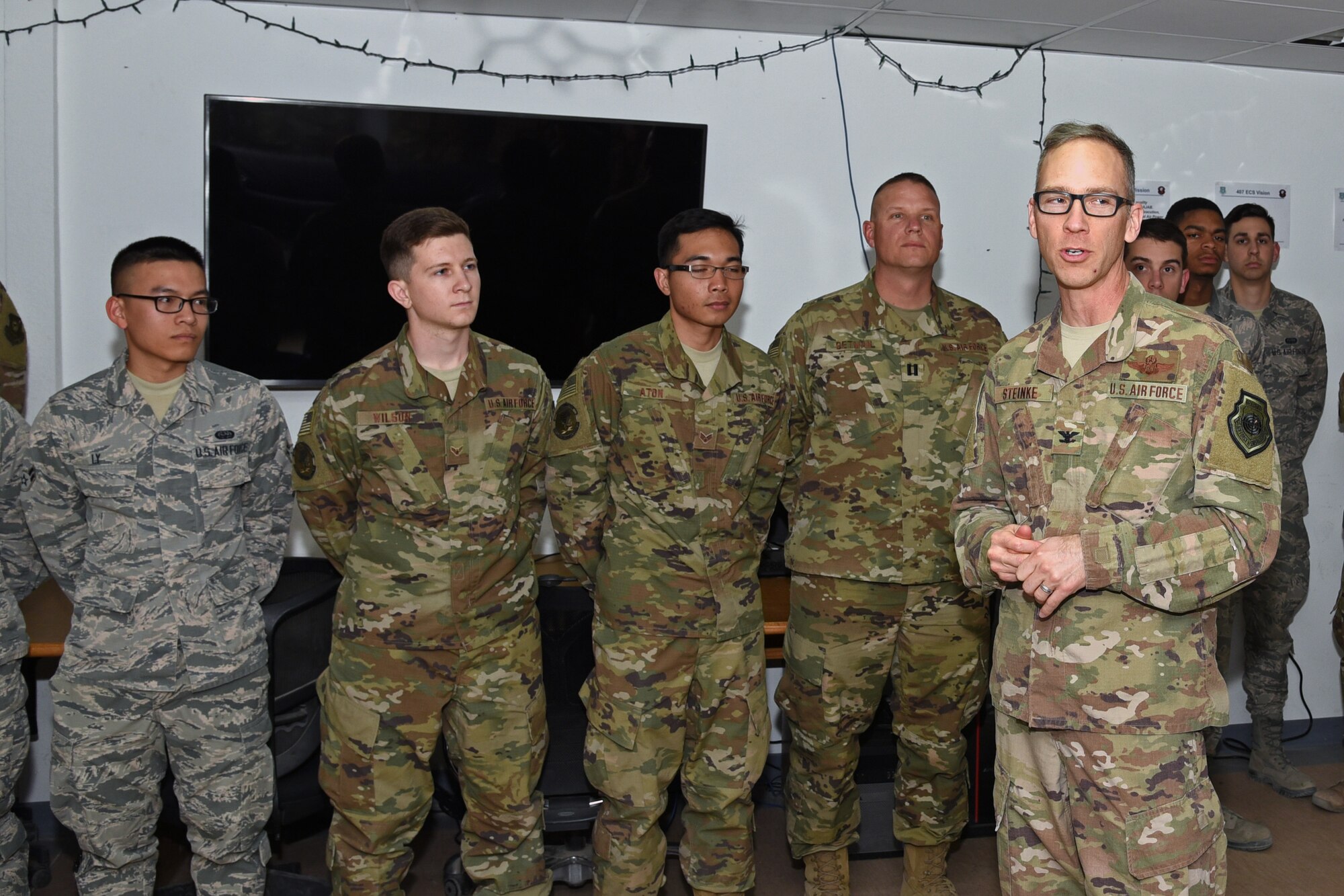 U.S. Air Force Col. Shane Steinke, 322nd Air Expeditionary Wing vice commander, speaks with members of the 407th Expeditionary Communications Squadron at an undisclosed location Feb. 5. Steinke thanked them for their work and answered a few questions. (U.S. Air Force photo by Staff Sgt. Joshua Edwards/Released)