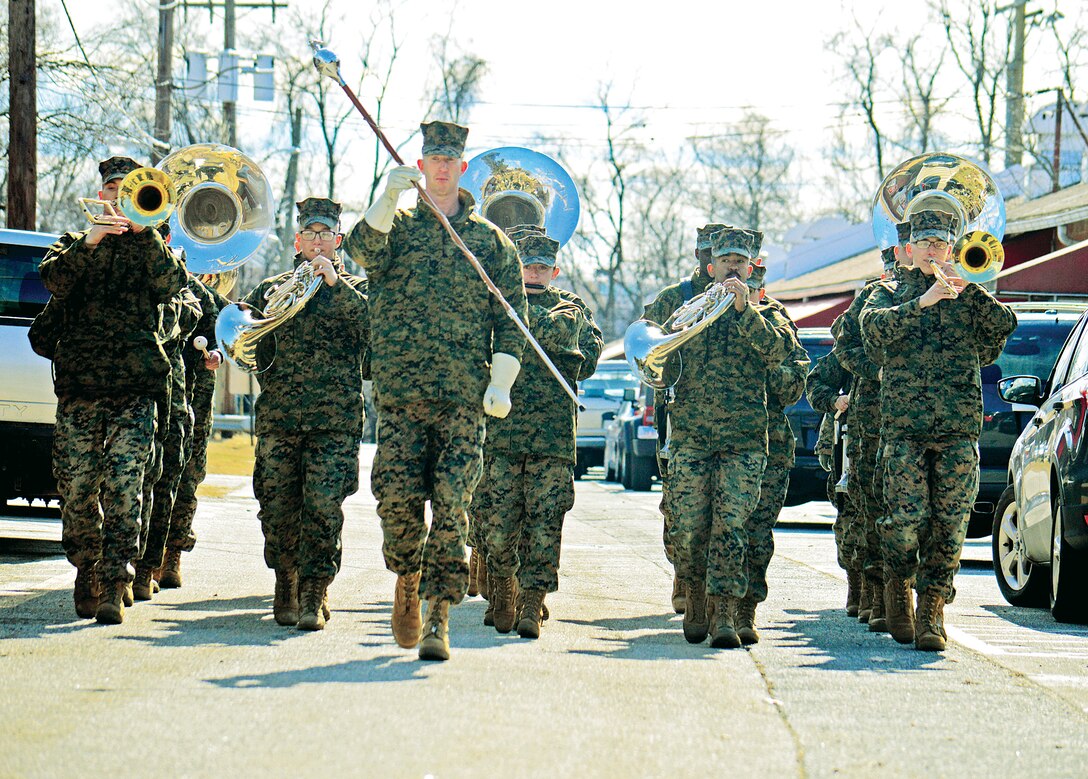 Leading the charge, Staff Sgt. James Mathis, drum major of the Quantico Marine Corps Band begins their four mile march outside the band hall on Roan st toward the Officer Candidates School.