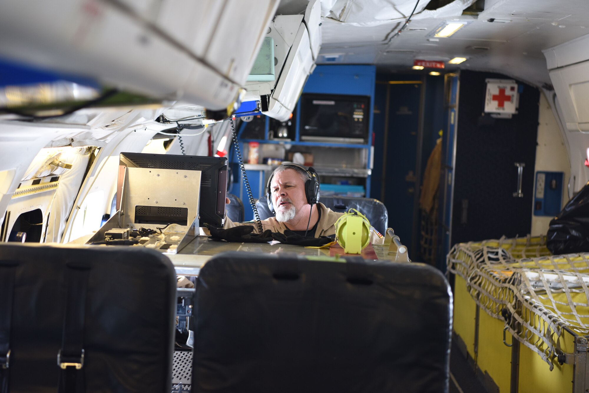 Lyn Lohberger, NASA Armstrong flight research center safety technician, checks diagnostics of the aircraft midflight, Jan. 31, 2018. Lohberger is a contractor for NASA and has been employed by them for 11 years.