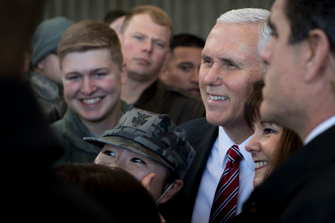 Vice President Mike Pence takes a photo with a member of the Japan Air Self-Defense Force.