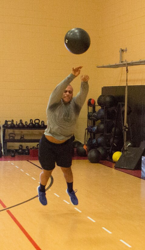 Sgt. James Toney, security specialist, U.S. Marine Corps Forces Command, tosses a 20-pound medicine ball during a High Intensity Tactical Training Level I instructor course at Hopkins Hall Gym aboard Camp Allen, in Norfolk, Va., Feb. 
6. Marines worked with medicine balls to build their explosive power, however, an  element of sprints and push-ups were added to build anaerobic endurance.
"This training teaches me more than just working out with weights," said Toney.
Every HITT workout begins and ends with a dynamic warm-up and cool-down stretching that focuses on core stability and flexibility. HITT coordinators  stress these concepts because failure to do so can lead to serious injury, according to Harper. (Official Marine Corps photo by Chris Jones/Released)