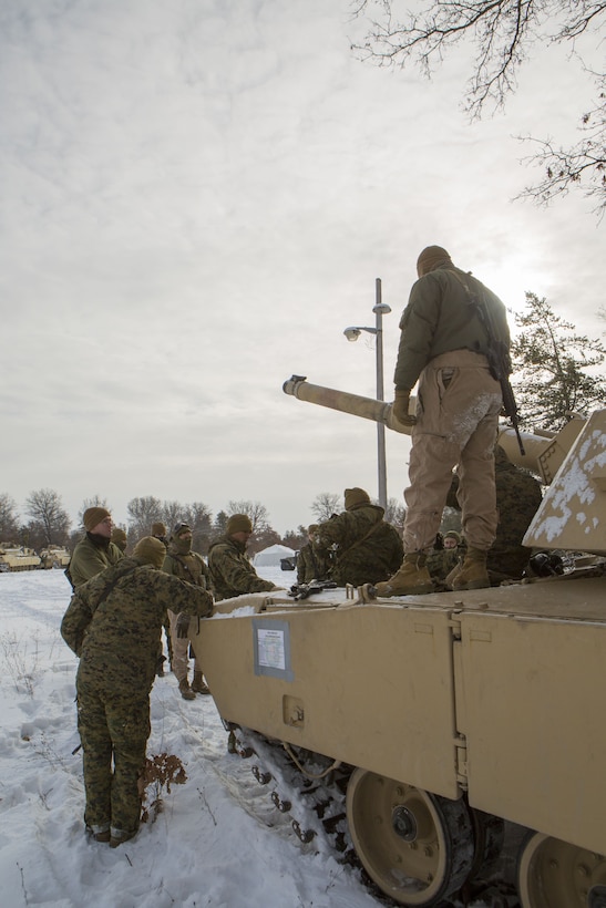 Reserve Marines with Company F, 4th Tank Battalion, 4th Marine Division, gather for a class on tank cover and concealment techniques during exercise Winter Break 2018, Feb. 7, 2018.