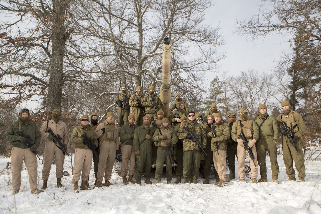 Reserve Marines with Company F, 4th Tank Battalion, 4th Marine Division, pose for a photo on training day one of exercise Winter Break 2018 on Camp Grayling, Michigan, Feb. 7, 2018.