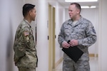 Master Sgt. Robert George, Medical Education & Training Campus pharmacy training senior enlisted leader, speaks with a pharmacy student Feb. 5 at Joint Base San Antonio-Fort Sam Houston. George leads Department of Defense’s pharmacy technician program prepares students to perform both inpatient and outpatient pharmacy operations in both traditional and non-traditional pharmacy practice.