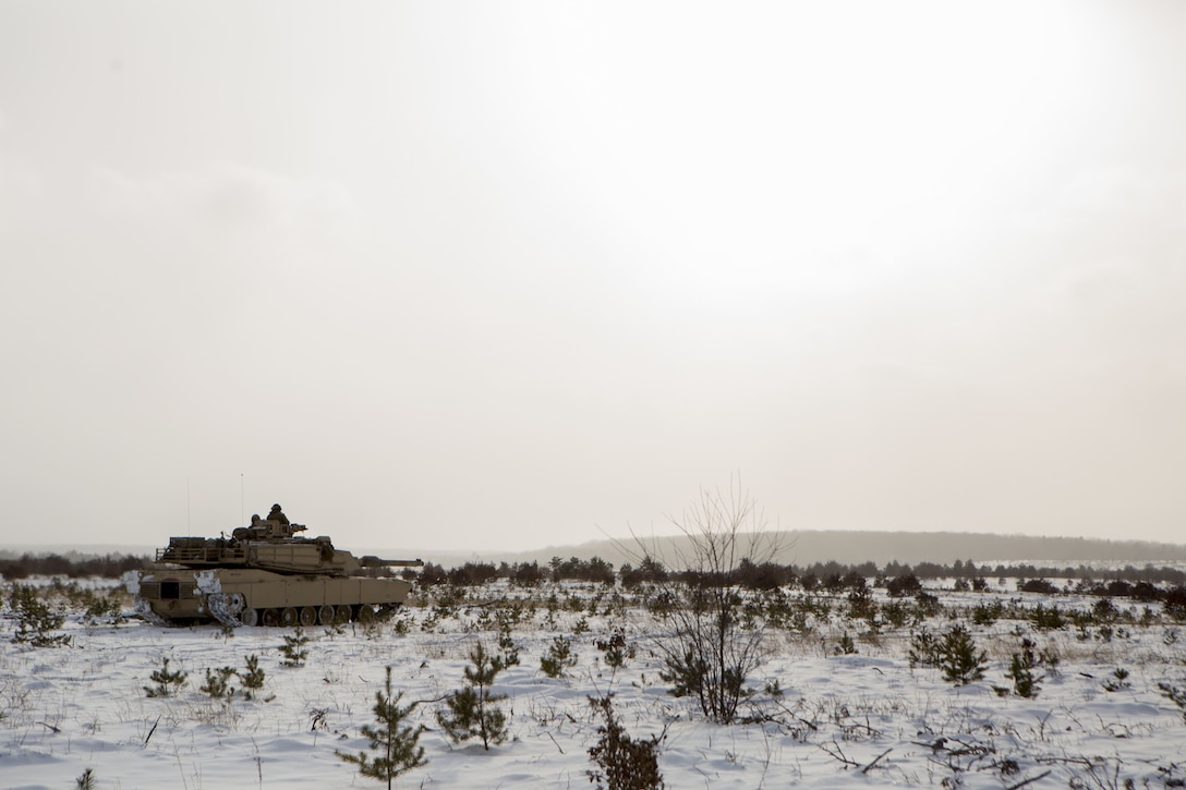 Reserve Marines with Company F, 4th Tank Battalion, 4th Marine Division, move through a training area in an Abrams M1A1 Main Battle Tank during formation rehearsals at exercise Winter Break 2018, Feb. 7, 2018.