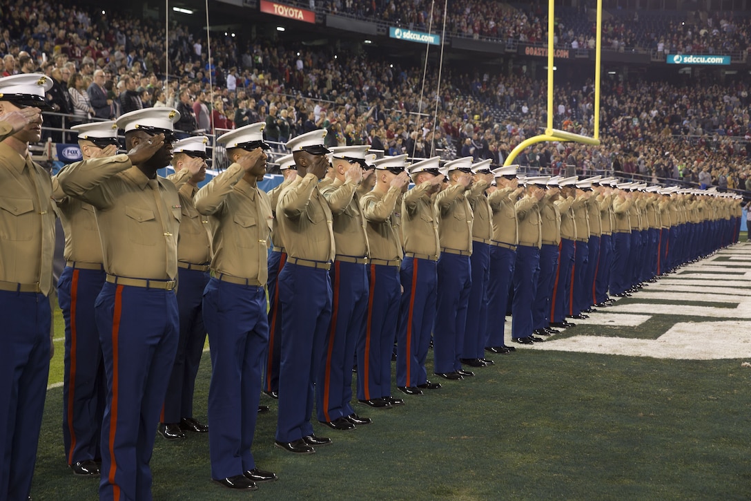 Marines and sailors with I Marine Expeditionary Force salute the flag during the San Diego County Credit Union Holiday Bowl National Anthem, Dec. 28, 2017. In 2017, I MEF Marines and Sailors supported more than 140 community events.