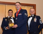 Col. Dana Nelson, 507th Air Refueling Wing vice commander, and Chief Master Sgt. David Dickson, 507th ARW command chief, present the 2017 507th ARW Noncommissioned Officer of the Year award to Staff Sgt. Casey Cottrell, 507th Logistics Readiness Squadron, Feb. 3, 2018, in Midwest City, Okla. (U.S. Air Force photo/Tech. Sgt. Samantha Mathison)