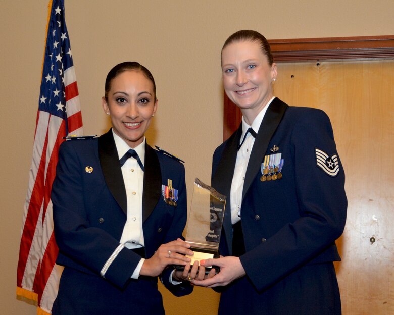 Maj. Amanda Hacman, 507th Force Support Squadron commander, presents the 2017 507th FSS Summit Award for outstanding performance to Tech. Sgt. Amanda Baty, 507th FSS, Feb. 3, 2018, Midwest City, Okla. (U.S. Air Force photo/Tech. Sgt. Samantha Mathison)
