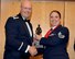 Col. Travis Caughlin, 507th Maintenance Group commander, presents the 2017 507th MXG Maintenance Professional of the Year award in the Airman category for outstanding performance to Staff Sgt. Kaycee Graham, 507th Maintenance Squadron, Feb. 3, 2018, in Midwest City, Okla. (U.S. Air Force photo/Tech. Sgt. Samantha Mathison)
