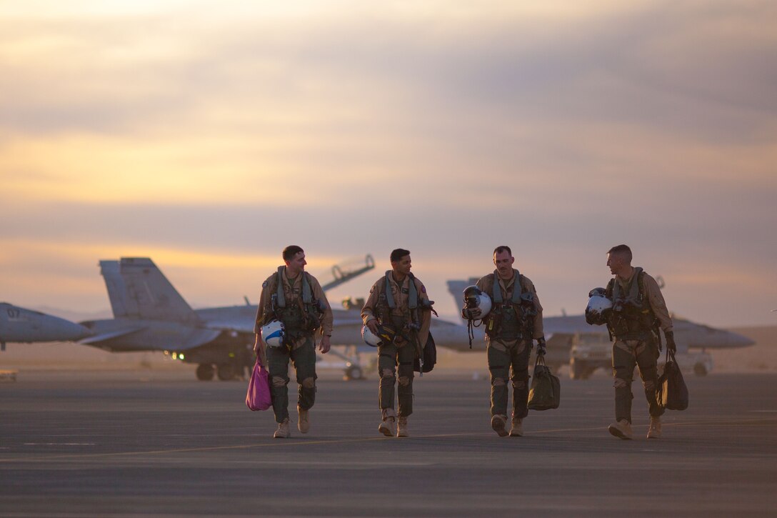 Marine pilots with Marine Fighter Attack Squadron All-Weather 225 walk off the Air Combat Element landing strip aboard the Marine Corps Air Ground Combat Center, Twentynine Palms, Calif., Jan. 29, 2018, as a part of Integrated Training Exercise 2-18. The purpose of ITX is to create a challenging, realistic training environment that produces combat-ready forces capable of operating as an integrated MAGTF.