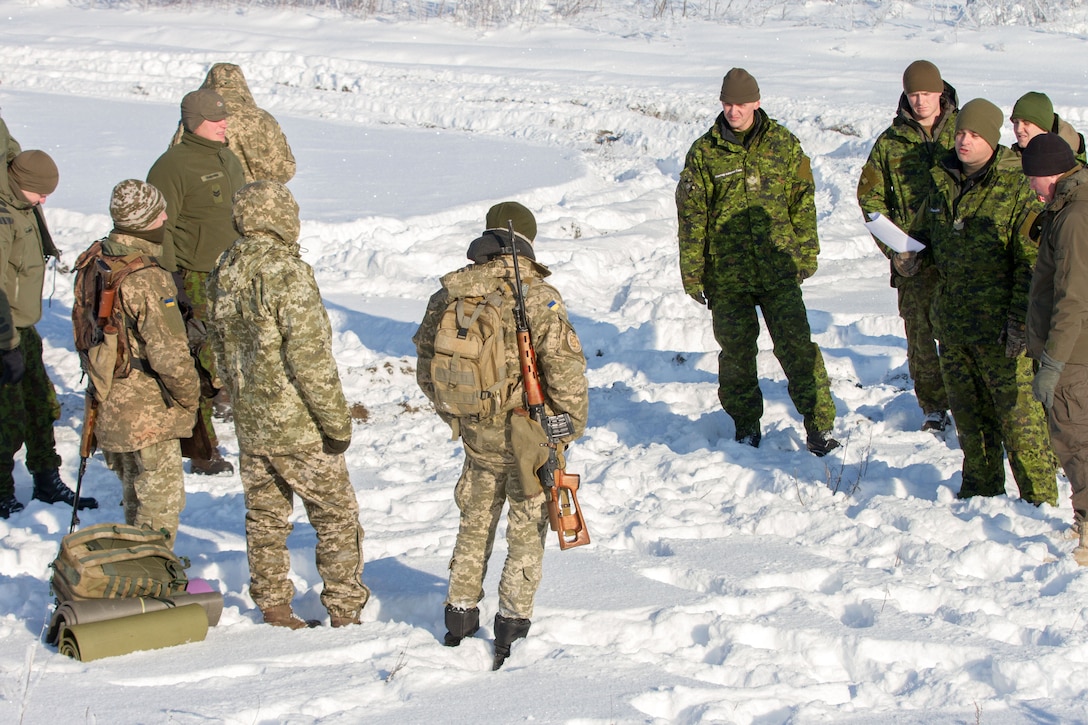 U.S., Canadian, Ukrainian and Lithuanian service members conduct joint marksmanship training