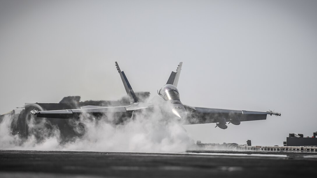 180206-N-MJ135-1243 ARABIAN GULF (Feb. 6, 2018) An F/A-18F Super Hornet, assigned to the Fighting Redcocks of Strike Fighter Attack Squadron (VFA) 22, launches from the flight deck of the aircraft carrier USS Theodore Roosevelt (CVN 71). Theodore Roosevelt and its carrier strike group are deployed to the U.S. 5th Fleet area of operations in support of maritime security operations to reassure allies and partners and preserve the freedom of navigation and the free flow of commerce in the region. (U.S. Navy photo by Mass Communication Specialist 3rd Class Spencer Roberts/Released)