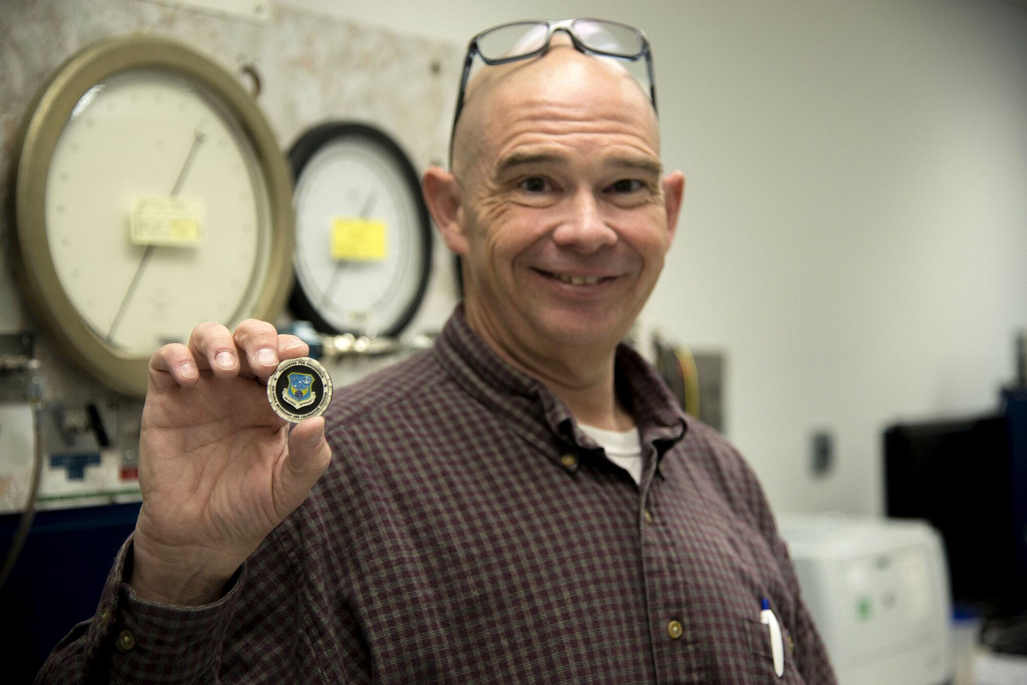 Dave McMillan, quality assurance evaluator for Kirtland’s Precision Measurement Equipment Laboratory, was presented with an AFMETCAL Excellence Coin in recognition of his outstanding work as a quality assurance evaluator during a recent inspection.