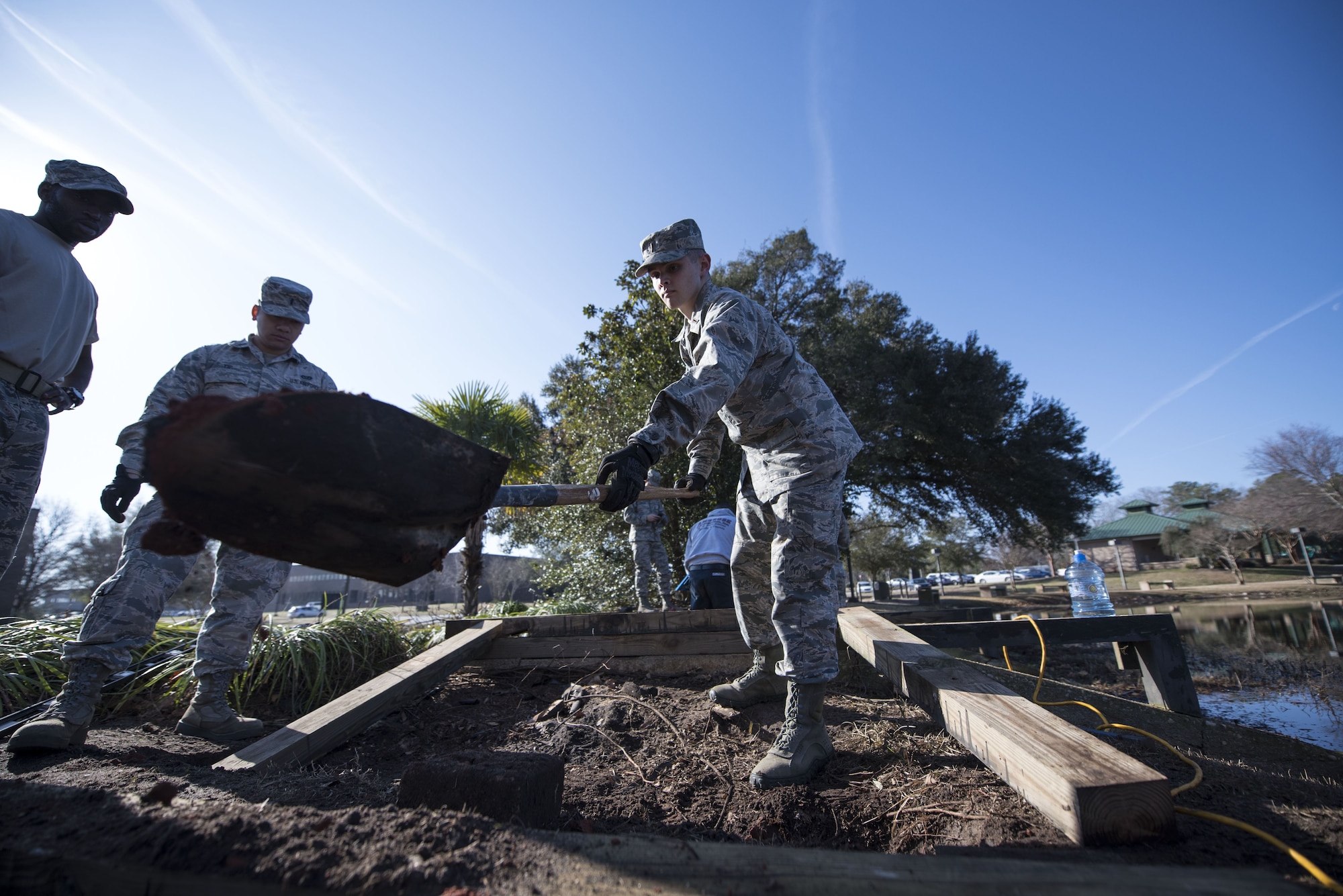 U.S. Air Force 2nd Lt. Stone Williford, 20th Civil Engineer Squadron real property specialist, removes dirt to level the ground at Shaw Air Force Base, S.C., Feb. 6, 2018.