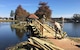 Volunteers work to restore the bridge at Memorial Lake at Shaw Air Force Base, S.C., Nov. 15, 2017.