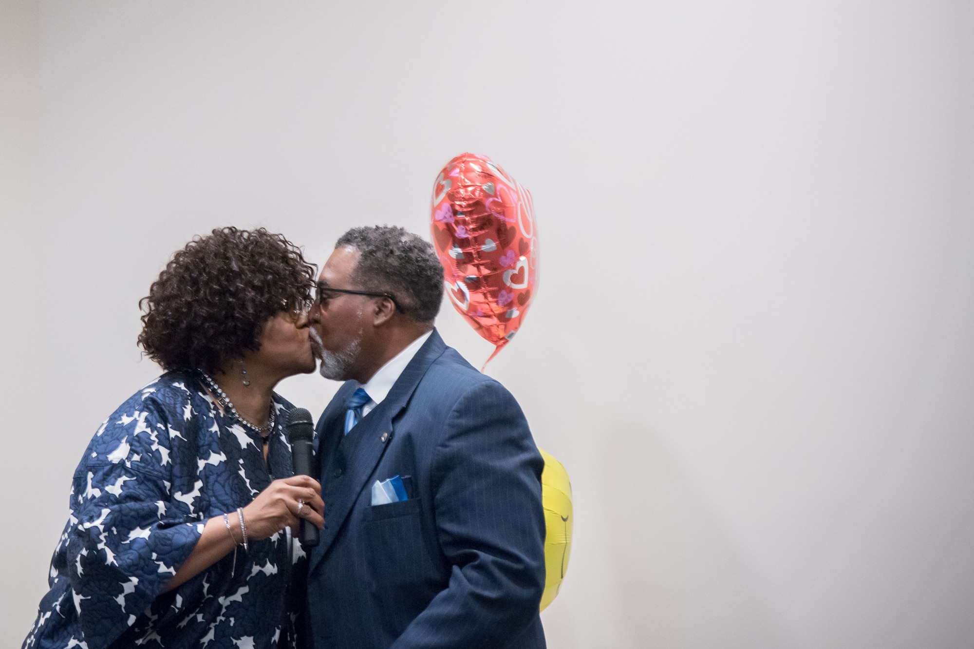YoLanda Wallace, 81st Mission Support Group, kisses her husband, Gary Wallace, 53rd Weather Reconnaissance Squadron aviation resources management technician, during his retirement ceremony Feb. 2, 2018 at Keesler Air Force Base, Mississippi. (U.S. Air Force photo by Staff Sgt. Heather Heiney)