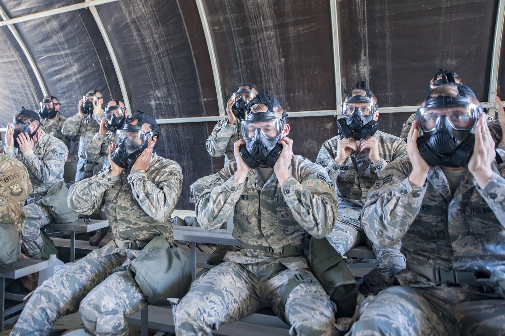 Airmen perform seal checks on their gas masks, Feb. 1, 2018, at Moody Air Force Base, Ga. Airmen participated in a chemical, biological, radiological and nuclear defense (CBRNE) class to better prepare them to combat enemy attacks while also familiarizing them with mission-oriented protective posture (MOPP) gear. (Air Force photo by Airman Eugene Oliver)