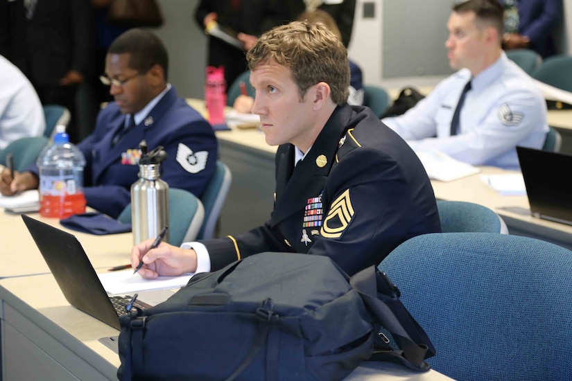 Army Sgt. 1st Class Joshua Richter listens to a lecture at George Mason University-Prince William Campus as a student in the Uniformed Services University of the Health Sciences’ Enlisted to Medical Degree Preparatory Program in 2014.