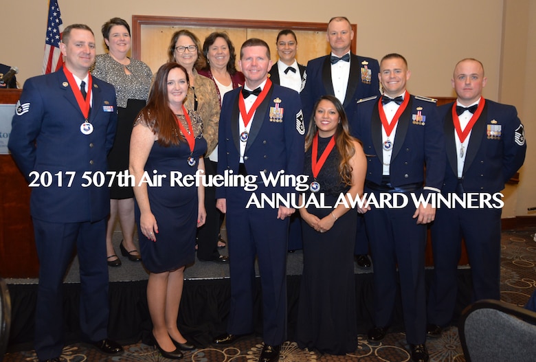 The 2017 507th Air Refueling Wing Annual Award winners pose for a photo Feb. 3, 2018, in Midwest City, Okla. Front row: Staff Sgt. Casey Cottrell, NCO of the Year; Mrs. Lauren Gleason, Civilian of the Year; Senior Master Sgt. Ronald Pyles, 1st Sgt. of the Year; Mrs. Jennifer Smith, Spouse of the Year; 2nd Lt. Ryan Cheney, Company Grade Officer of the Year; and Master Sgt. Ricky Buettner, Senior NCO of the Year. Back row: Community partners Mrs. Tasha Windisch, Ms. Kathy Gillette and Ms. Jan Davis from the Moore Chamber of Commerce and Tinker Federal Credit Union; Col. Dana Nelson, 507th Air Refueling Wing vice commander; ahd Chief Master Sgt. David Dickson, 507th ARW command chief. (U.S. Air Force photo/Tech. Sgt. Samantha Mathison)